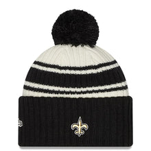 Load image into Gallery viewer, New Orleans Saints New Era NFL Cuffed Pom Knit Beanie Hat Cream/Black Crown/Visor Team Color Logo (2022 Sideline)