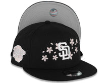 Load image into Gallery viewer, San Diego Padres New Era MLB 9FIFTY 950 Snapback Cap Hat Black Crown/Visor White Logo With Pink Cherry Blossoms 1998 World Series Side Patch Gray UV
